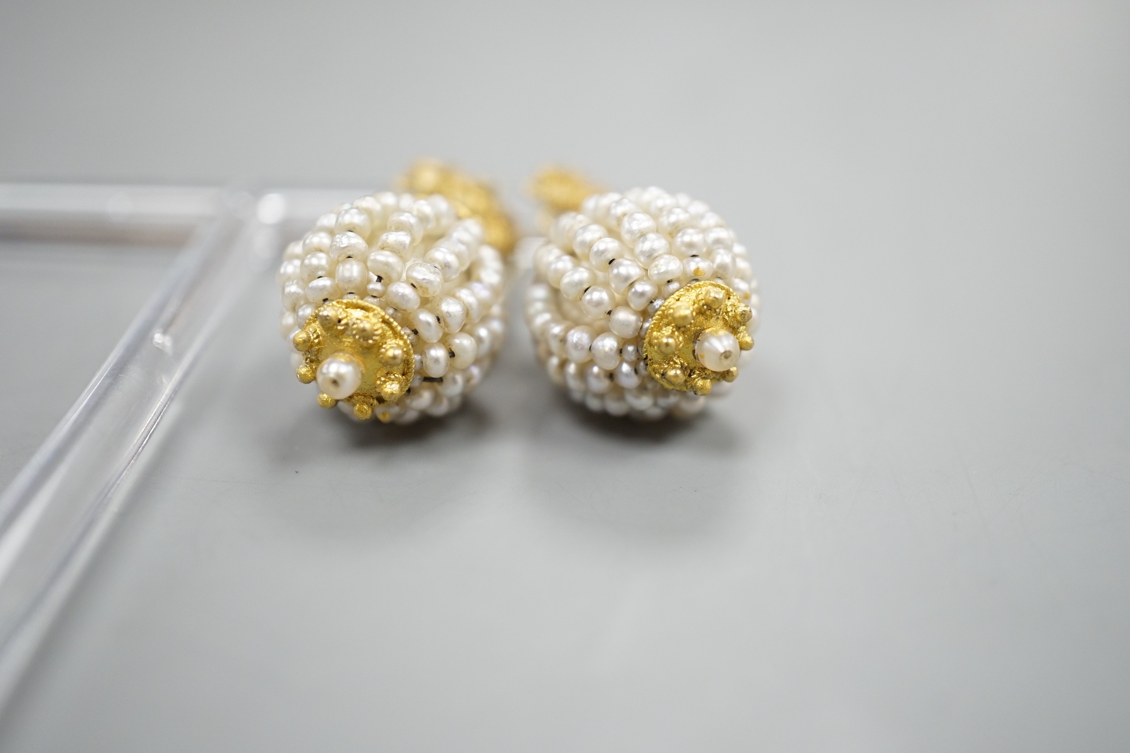 A pair of 19th century filigree yellow metal and multi seed pearl set spherical drop earrings, 34mm, gross weight 9.3 grams.